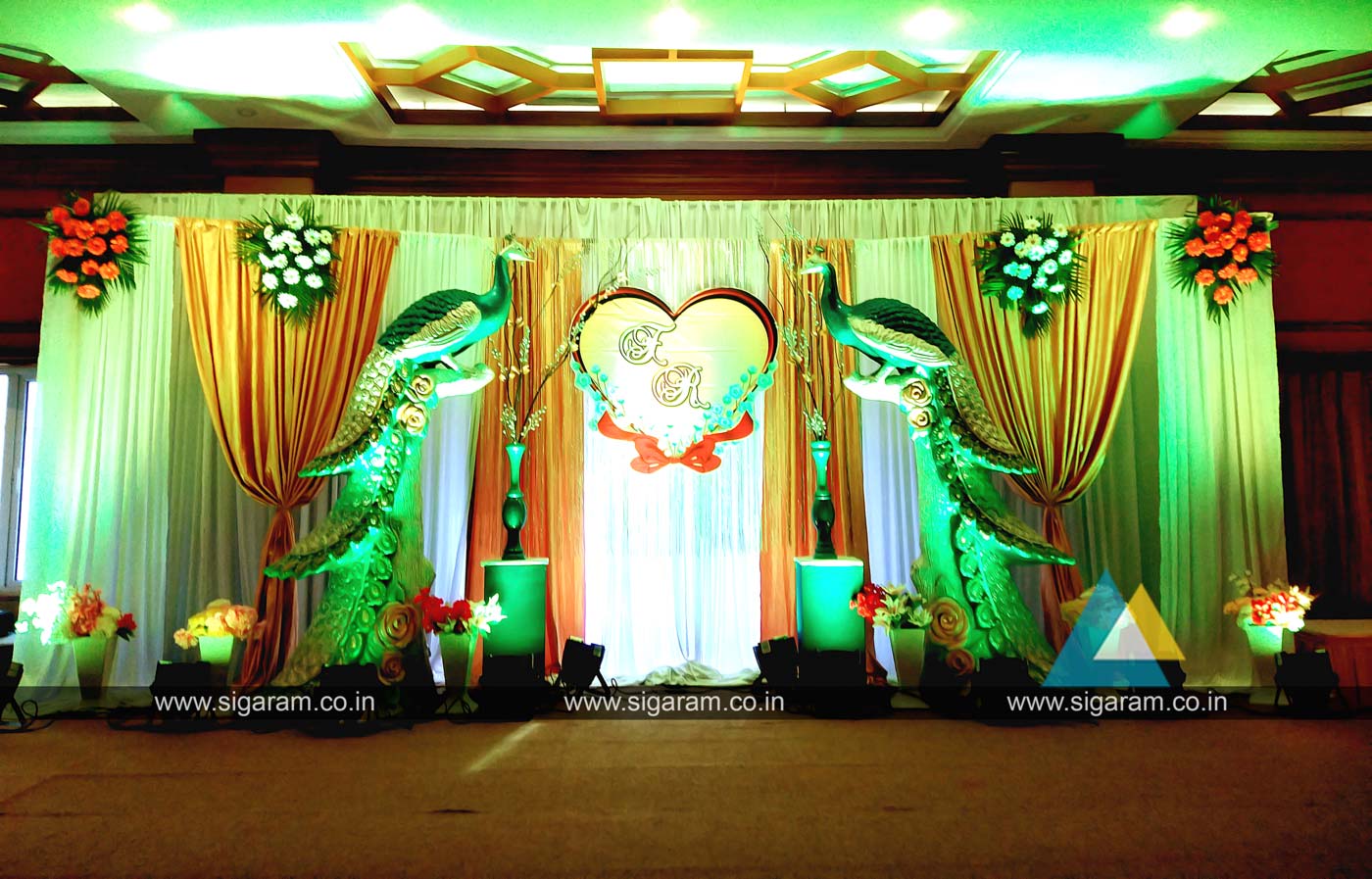 Peacock themed Engagement Stage decoration at Hotel Shenbaga ...