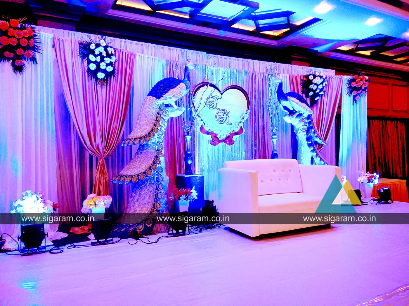 Peacock themed Engagement Stage decoration at Hotel Shenbaga ...